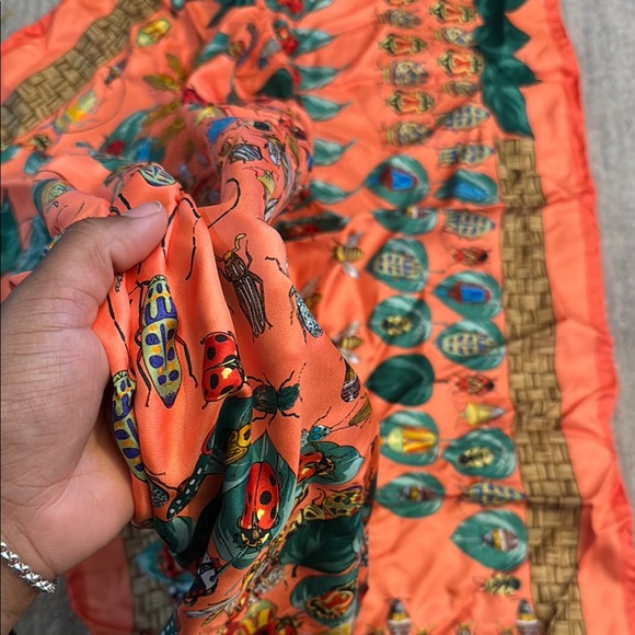 Vibrant Orange Silk Scarf with Floral and Leaf Patterns